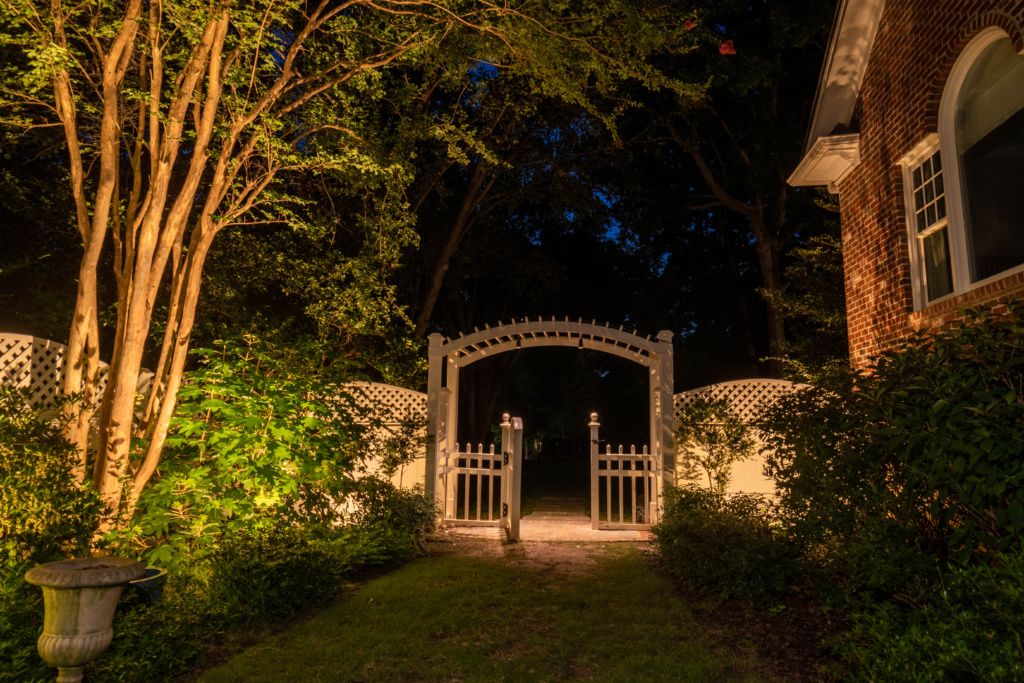 alt="softly lit courtyard with low lumen landscape lighting,by lite visions Raleigh NC"